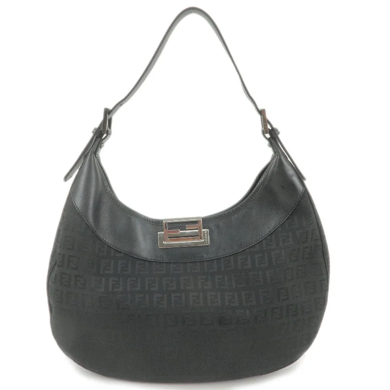 Ladies Fendi Peekaboo bags with a textured leather surface for a more tactile and luxurious feelFENDI Zucchino Canvas Leather Shoulder Bag Black 8BR552