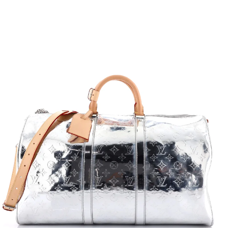 Louis Vuitton Alma bags featuring the signature top - handle designKeepall Bandouliere Bag Monogram Mirror Coated Canvas 50