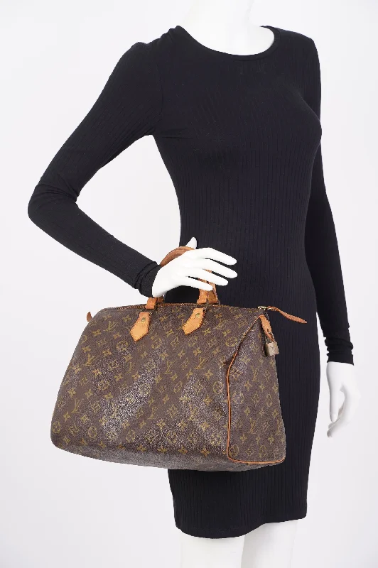 Louis Vuitton Alma bags with a leather - wrapped handle for a luxurious feelLouis Vuitton  Speedy Monogram Canvas 35