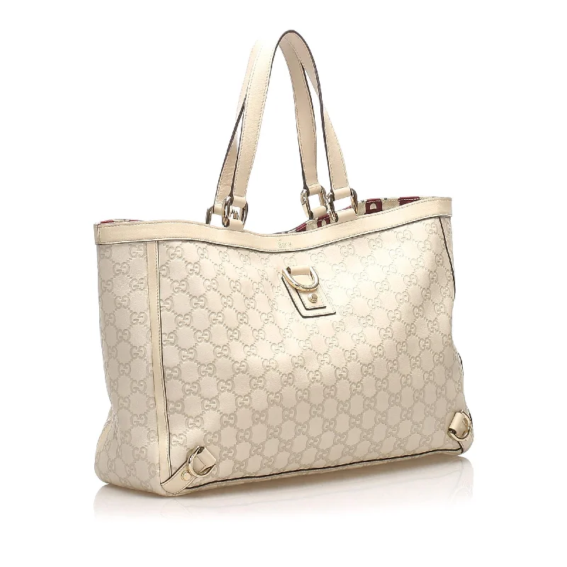 Women Gucci bags with a snap - button closure and a decorative charmGucci Guccissima Abbey D-Ring Tote Bag (21876)